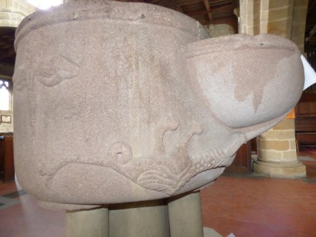 The Salamader curls around the font