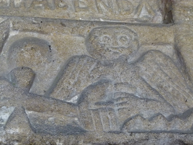 Norman tympanum at the church... an angel wielding Thor's hammer?