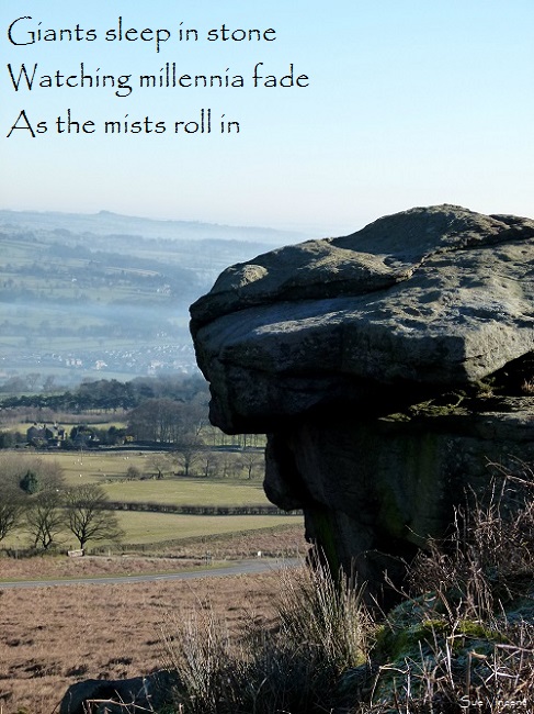 Giants sleep in stone Watching millennia fade As the mists roll in