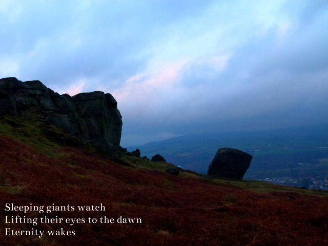 Sleeping giants watch, lifting eyes to the dawn, eternity wakes