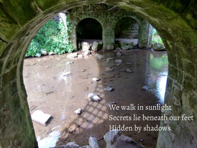 We walk in sunlight Secrets lie beneath our feet Hidden by shadows