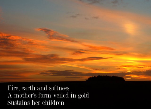 Fire, earth and softness A mother's form veiled in gold Sustains her children