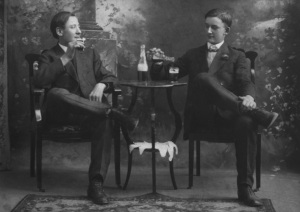 Two Seated Men Drinking Beer (Copyright http://www.circaimages.com) 