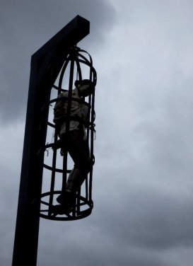 Caged hung figure #writephoto