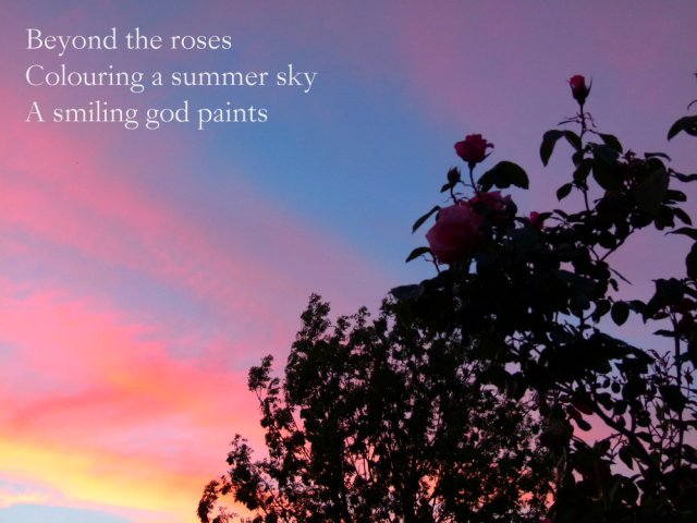 Beyond the roses Colouring a summer sky A smiling god paints
