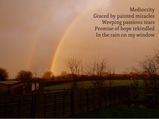 picure of rainbow against a dark sky