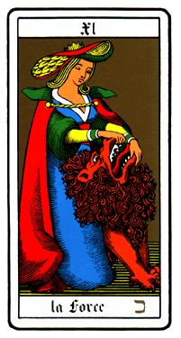 Tarot card 'strength' showing a woman calmly holding open the mouth of a lion