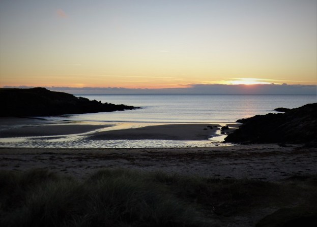 sunset over a sea cove